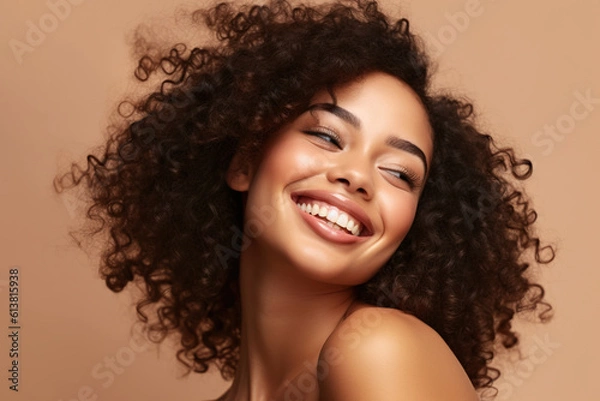 Fototapeta Beautiful girl smiling with curly hair and clean healthy skin on beige background. Generative AI and digital editing.