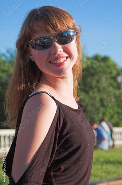 Fototapeta The young beautiful dared girl in sunglasses