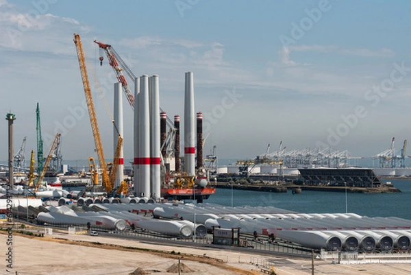 Obraz Port of Le Havre northern France. 2023. Offshore wind turbine installation ship loading turbine blades  bound for St Brieuc wind farm, off Brittany.