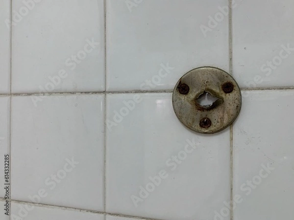 Fototapeta An old stainless steel hook with a hole resembling a face.