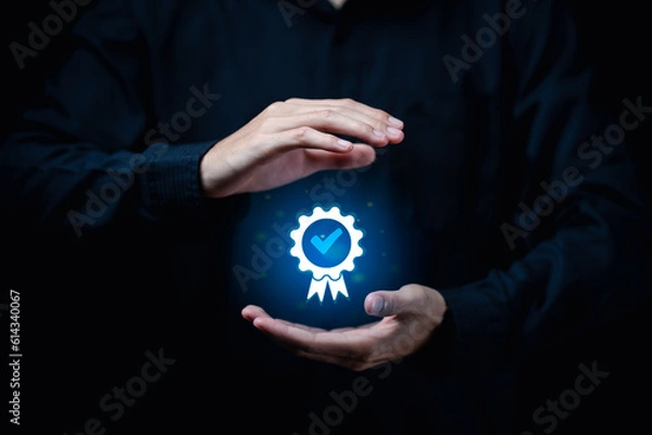 Fototapeta ISO certification and standardization concept.Certificate of quality, Hand shows the sign of the top service Quality assurance, Guarantee, Standards,