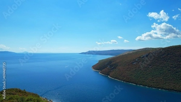 Fototapeta Plomin - Croatia - Top viewpoint with an outstanding view of the Kvarner Bay - An aerial drone view of the beautiful Croatian coastal landscape