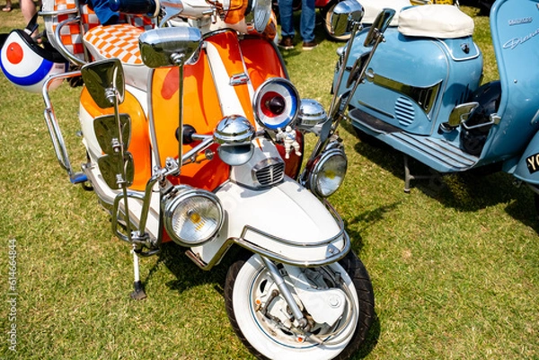Fototapeta The front end of a classic Lambretta scooter on display at a scooter rally on the green in the seaside town of Hunstanton on the North Norfolk coast