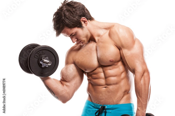 Obraz Muscular bodybuilder guy doing exercises with dumbbells over whi