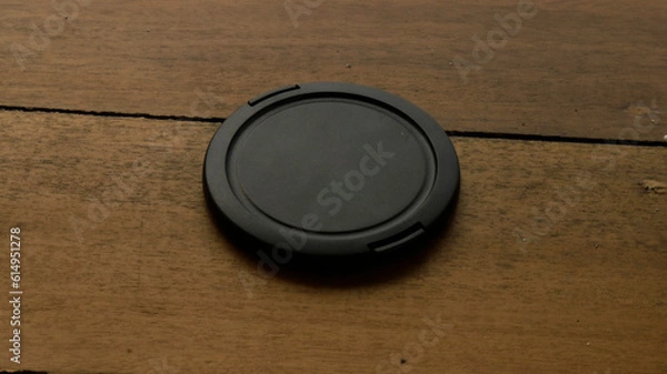 Obraz cover camera lens upside down on the table