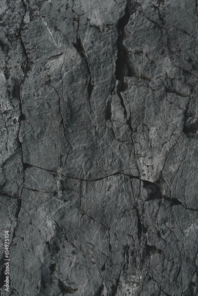 Fototapeta Dark rock texture background.Dark aged and cracked of black stone.