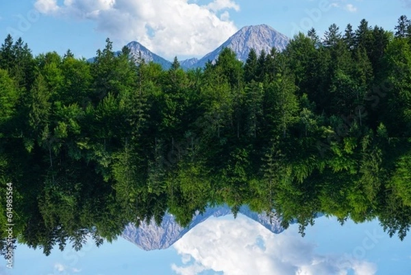 Fototapeta Mirrored mountains with sky in bavaria