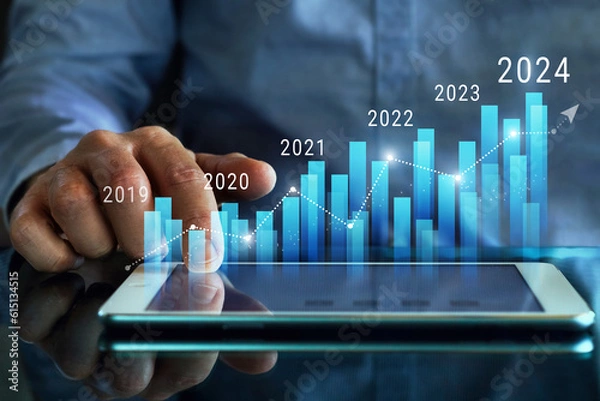 Fototapeta Column chart with company progress and growth by year, 2024, businessman calculates financial data for long term investments.