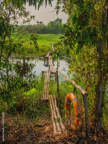 Fototapeta Escape the City Chaos: Experience Tranquility at Tan Lap Floating Village near Ho Chi Minh City, Vietnam