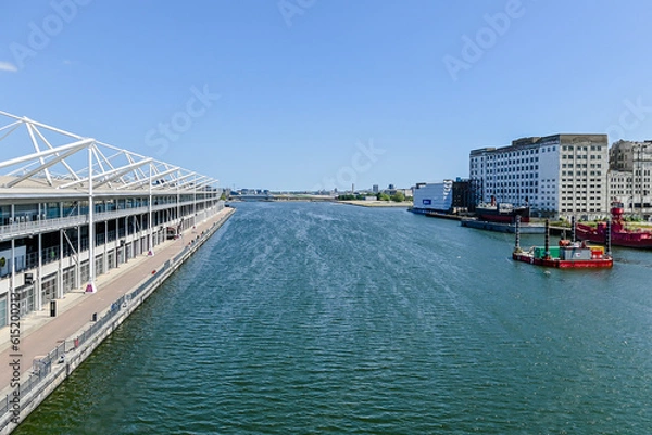 Obraz London, UK, 4 June  2023:  Aerial view of Excel Exhibition centre and Millennium Mills from bridge in middle of dock
