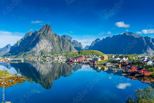 Fototapeta Perfect reflection of the Reine village on the water of the fjord in the Lofoten Islands,  Norway