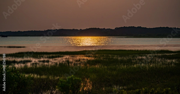 Fototapeta sunset over the river