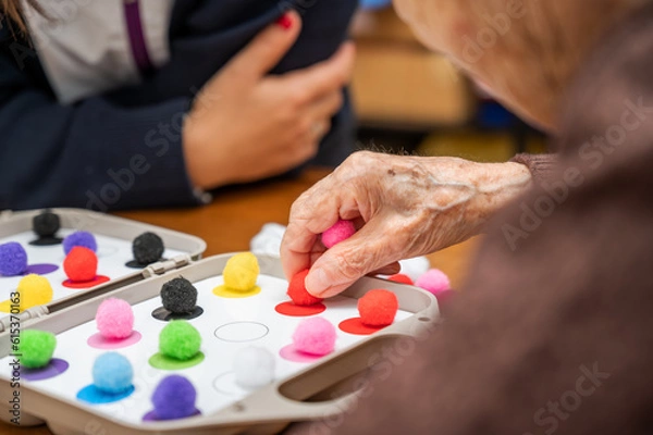 Fototapeta Rehabilitation center. Brain therapy cognitive psychological testing on senior patient. Alzheimer's disease and dementia prevention concept. Adaptation skills recovery. High quality photo