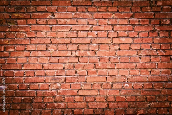 Fototapeta A red old brick masonry