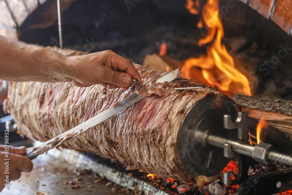 Obraz "Döner Kebab" is served with fresh greens on the board. famous turkish food.