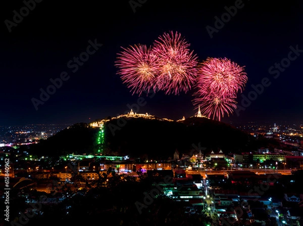 Fototapeta The most famous firework Pra Nakorn Kiri festival in Petchaburi Thailand. Fireworks display over three pagodas on Khao Wang hill at night. 