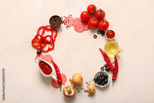 Fototapeta Frame made of fresh ingredients for preparing pizza on light background