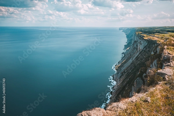 Fototapeta Cliff view- Stand at the edge of a high cliff and enjoy the breathtaking view of the sea or a valley