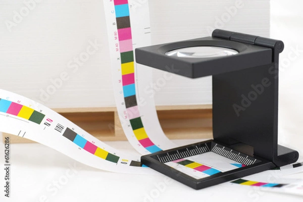 Obraz CMYK printing color bar and loupe.