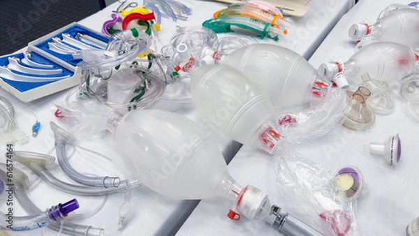Fototapeta Hospital airway kit signifies emergency airway management. Endotracheal tube, supraglottic airway, laryngoscope, and Ambu bag symbolize crucial interventions for respiratory support