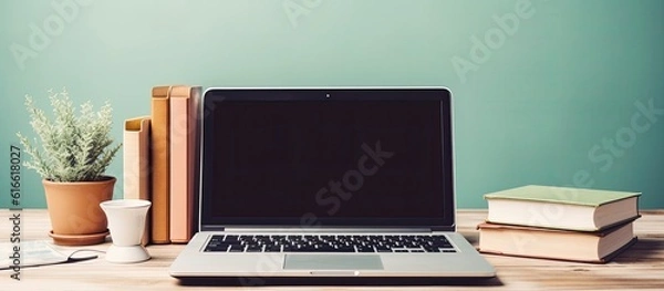Obraz A laptop computer sitting on top of a wooden desk created with Generative AI technology