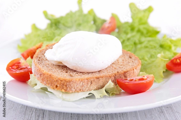Fototapeta poached egg on bread