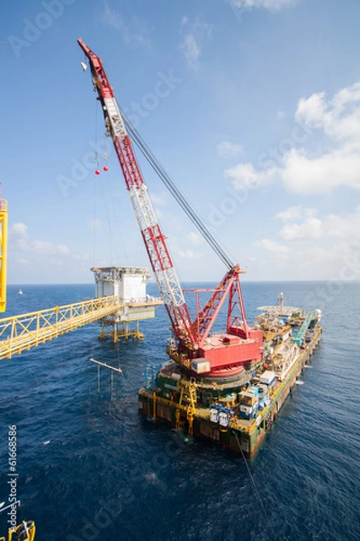 Obraz Large crane vessel installing the platform in offshore
