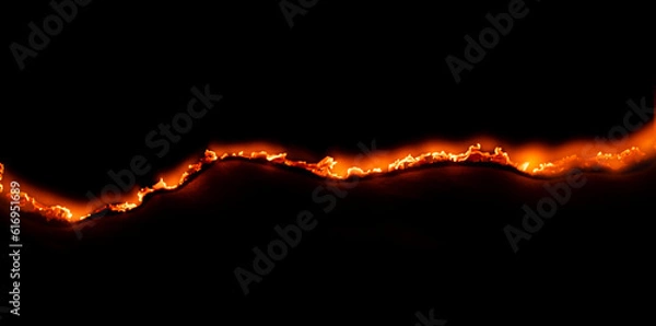 Fototapeta burning paper, glowing edge of paper on a black background
