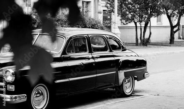 Fototapeta Black and white old-fashioned automobile.