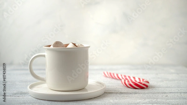 Fototapeta Cocoa marshmallows in traditional New Year's chocolate with caramel.