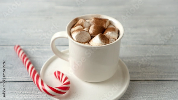Fototapeta Cocoa marshmallows in traditional New Year's chocolate with caramel.