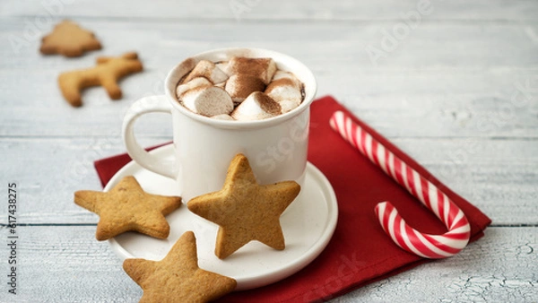 Fototapeta Cocoa marshmallows in traditional New Year's chocolate with caramel.