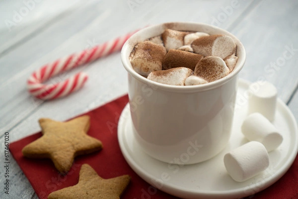 Fototapeta Cocoa marshmallows in traditional New Year's chocolate with caramel.