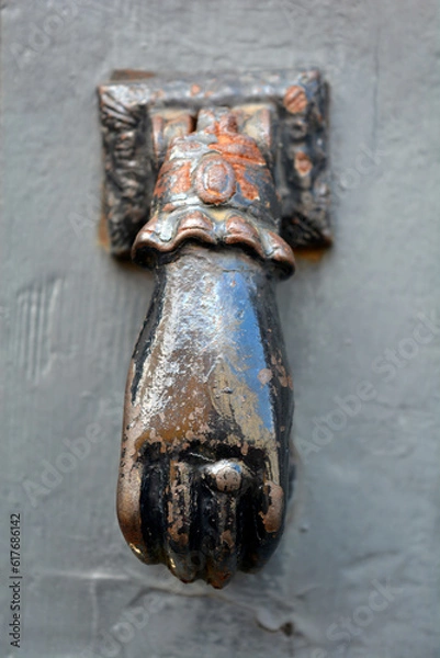 Obraz weathered hand door knocker