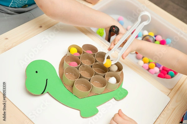 Obraz Happy turtle. Sorting game for toddlers. Fill cells with pompoms. Early education, learning colors and counting. Montessori thematic implement for preschool and special needs school