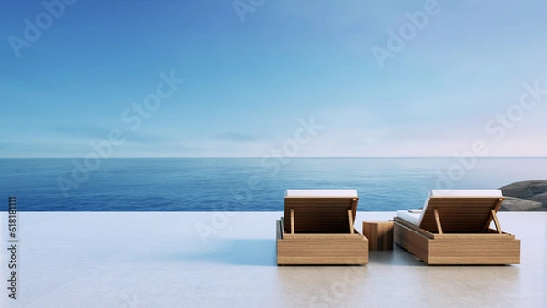 Fototapeta Luxury beach Lounge chair on the balcony overlooking the sea view - 3D rendering 