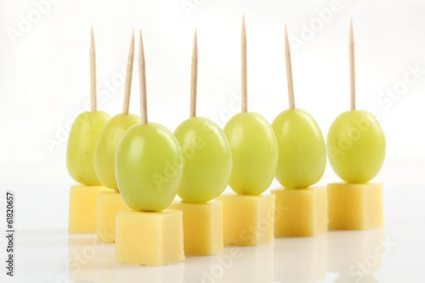 Obraz Appetizer - Grape with cheese on white background
