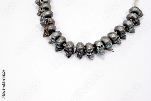 Fototapeta pewter skulls on string