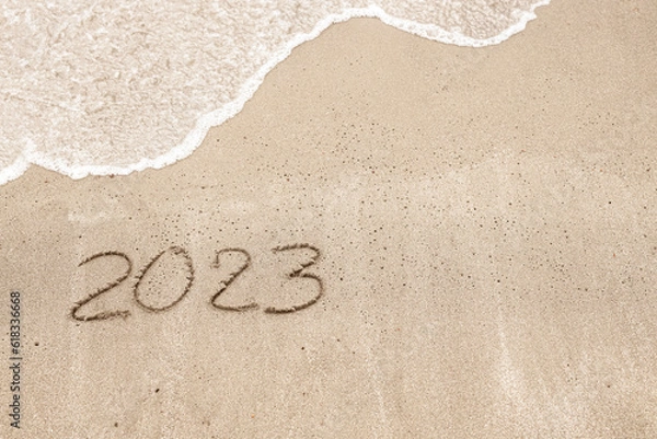 Obraz Inscription on the beach saying 2023 with a wave