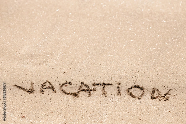 Obraz Word vacation written on the sand