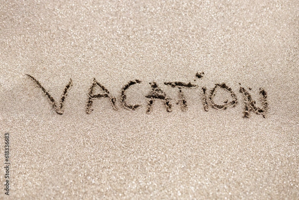 Obraz Word vacation written on the sand