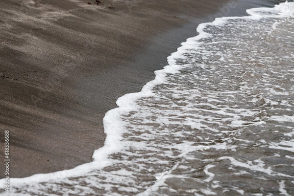 Obraz Wave on the black sand beach