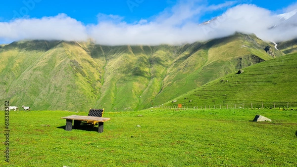 Obraz landscape in the mountains with wood table and chair