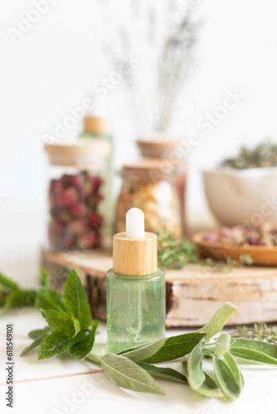 Fototapeta Botanical blends, herbs, essencial oils for naturopathy. Natural remedy, herbal medicine, blends for bath and tea on wooden table background