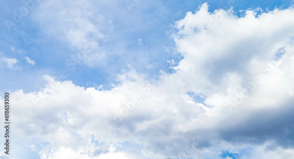 Fototapeta Scenic of white cumulus clouds floating above blue sky. Forecast cloudscape before rain in bright day, panoramic beauty scenery of nature. Abstract outdoor environment, white cloudy background