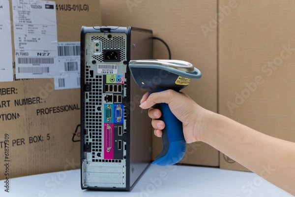 Obraz Holding and Scanning label on the computer with bluetooth barcod