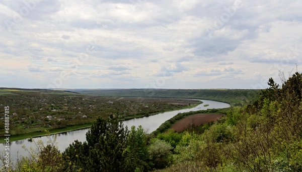 Fototapeta Scenic bird's eye view of the village, river and houses on the other side of the river