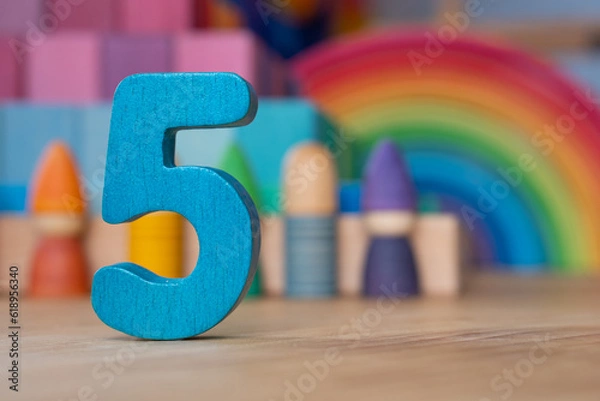 Obraz Wooden five on rainbow background