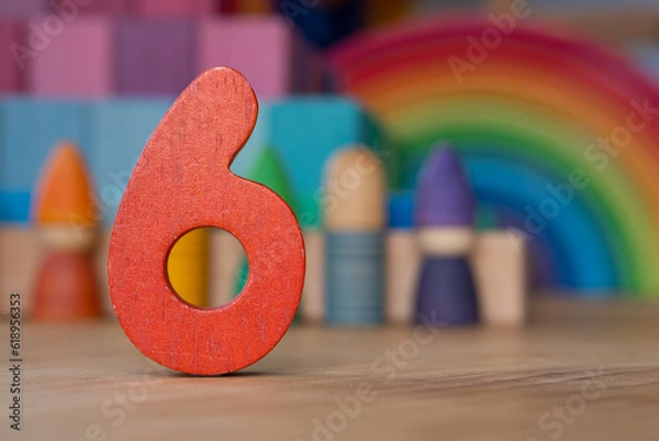 Obraz Wooden six on rainbow background