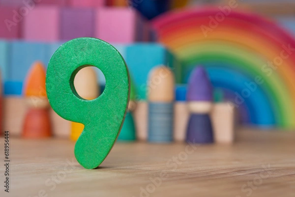 Obraz Wooden number nine on rainbow backdrop